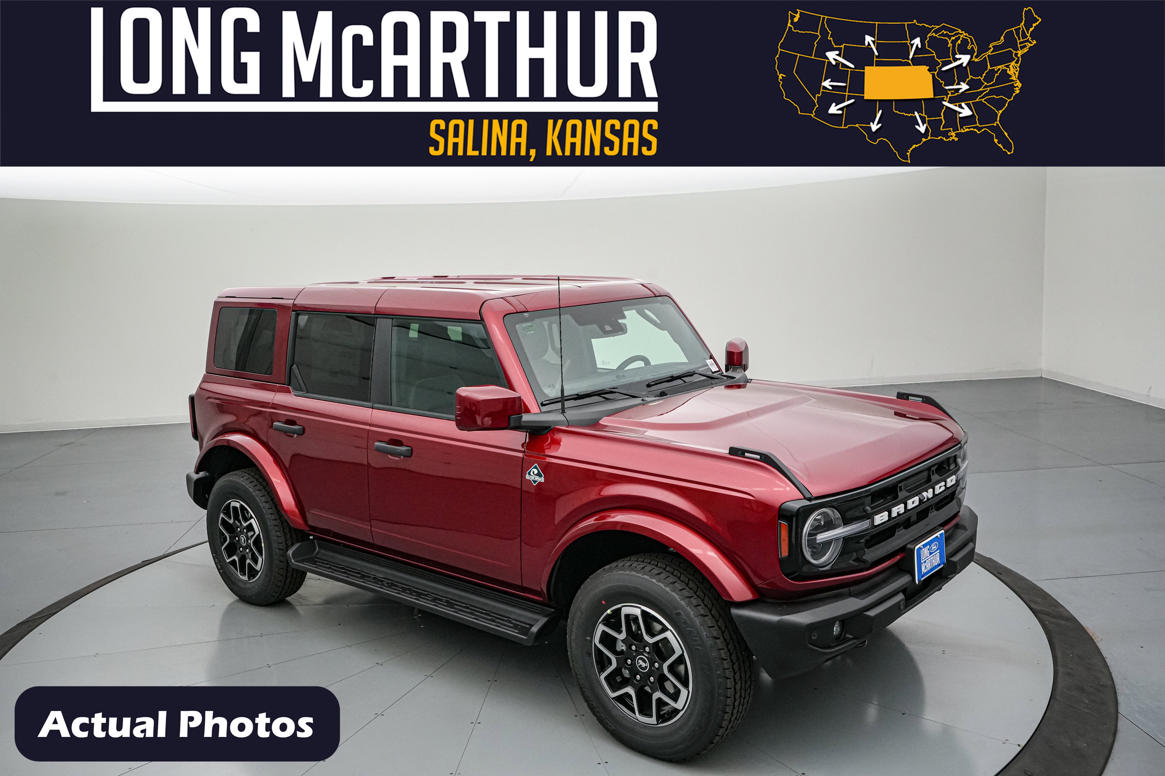 2026 Ford Bronco Outer Banks in Ruby Red Metallic Tinted Clearcoat — front three-quarter view