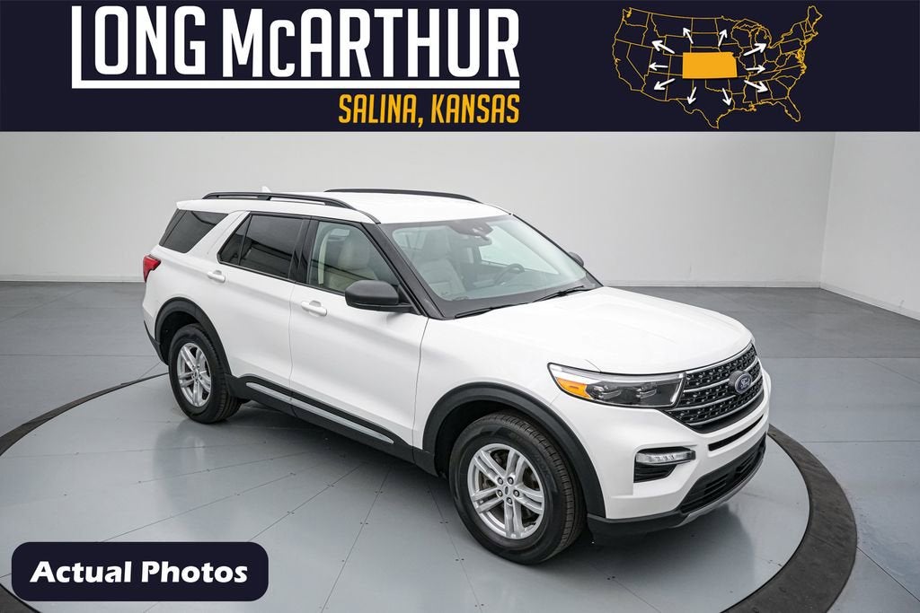 2023 Ford Explorer XLT in Star White Metallic Tri-Coat — front three-quarter view