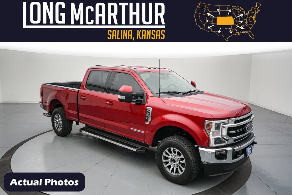 2022 Ford F-250SD Lariat in Rapid Red Metallic Tinted Clearcoat — front three-quarter view